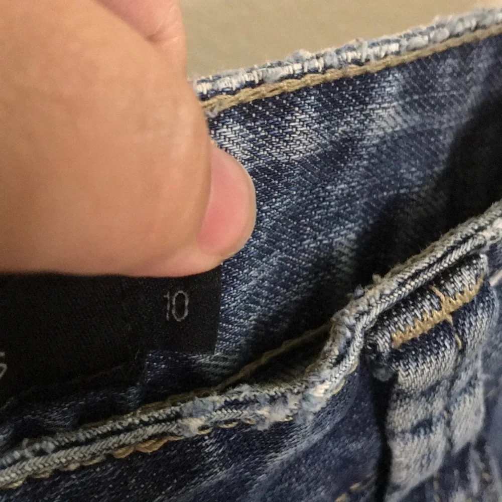 Calvin Klein distressed medium dark wash jeans 10